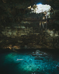 High angle view of woman swimming in sea