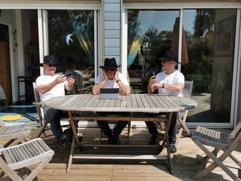 Group of people sitting on table