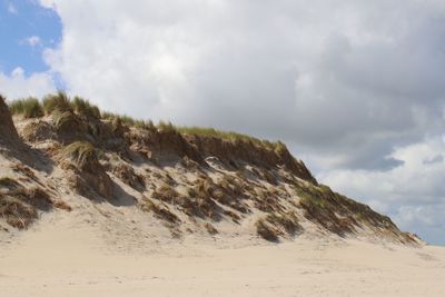 Scenic view of dune against sky