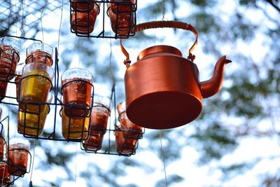 Low angle view of kettle against blurred background