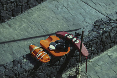 High angle view of shoes on stone wall