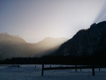 Scenic view of mountains against clear sky during winter