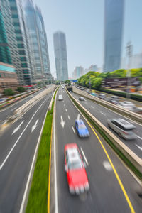 Blurred motion of vehicles on road in city