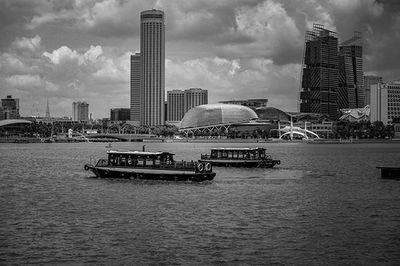 Buildings against cloudy sky