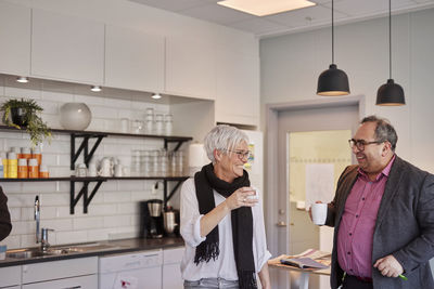 Man and woman talking during coffee break