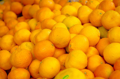 Full frame shot of oranges at market stall