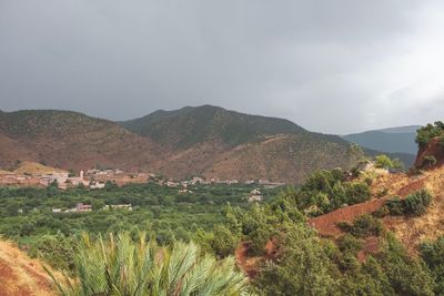 Scenic view of landscape and mountains against sky