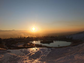 Scenic view of landscape against sky during sunset