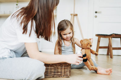 Mother and girl at home