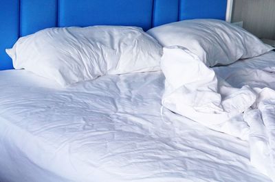 White blanket on bed at home