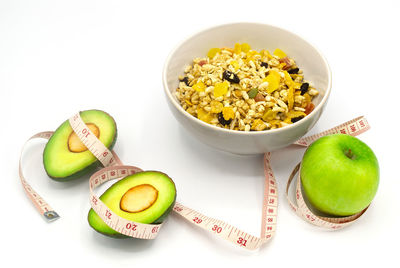 High angle view of various fruits in bowl on table