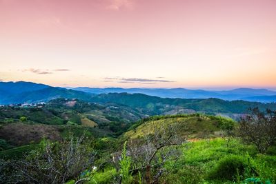 Scenic view of landscape against sky during sunset