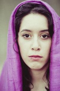 Close-up portrait of young woman wearing headscarf