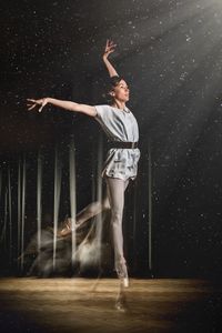 Full length of ballet dancer dancing on stage