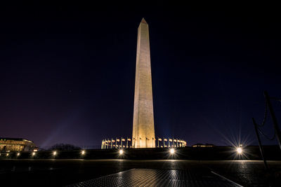 Low angle view of illuminated monument against sky at night