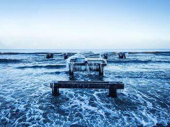 Old pier on sea during winter