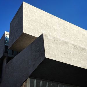 Low angle view of building against blue sky