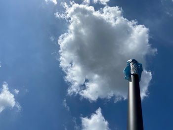 Low angle view of statue against blue sky