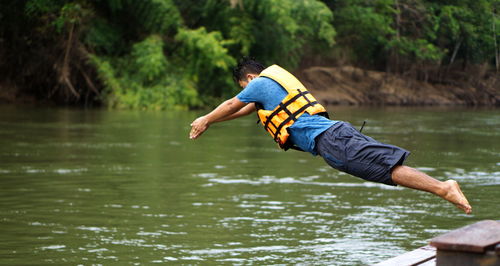 Rear view of man in lake