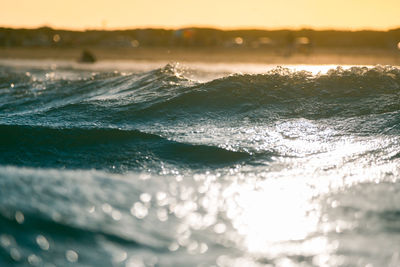 Close-up of waves in the ocean with sunlight reflected