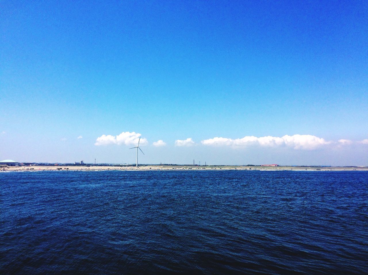 blue, water, sea, tranquil scene, tranquility, waterfront, scenics, beauty in nature, sky, copy space, nature, horizon over water, rippled, idyllic, seascape, calm, ocean, outdoors, no people, day