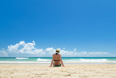 Pretty young woman enjoying on the beach in fuerteventura, canary islands, spain.