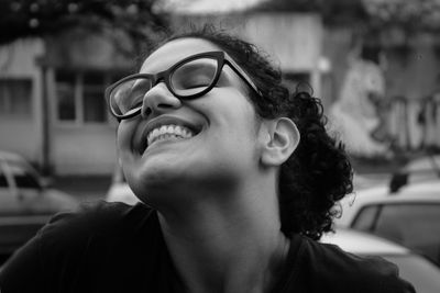 Portrait of smiling young woman looking away