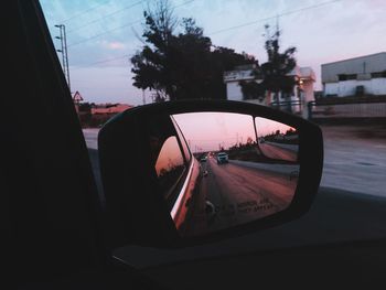 Reflection of car on side-view mirror
