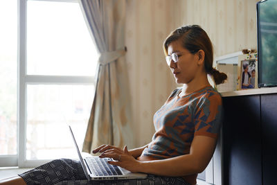 Woman use computer laptop for work from home