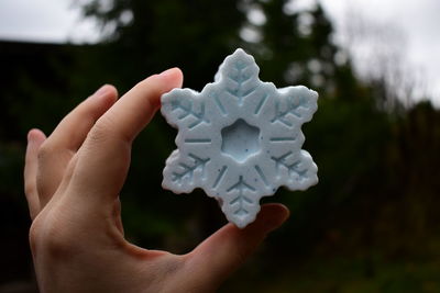 A bar of soap in the shape of a snowflake