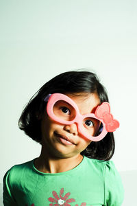 Portrait of boy against white background