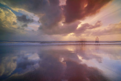 Scenic view of sea against sky at sunset