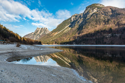 Scenic view of lake and mountains against sky