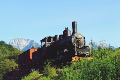View of mountain range against clear blue sky
