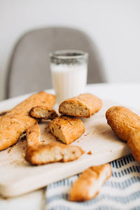 Freshly baked cookies and a glass of milk on the table