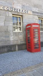 Red text on wall of building