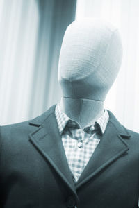 Mannequin wearing suit in store