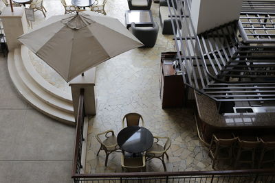 High angle view of empty chairs on table