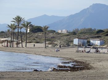 Scenic view of a beach in marbella, spain against sky.