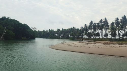 Scenic view of lake against cloudy sky