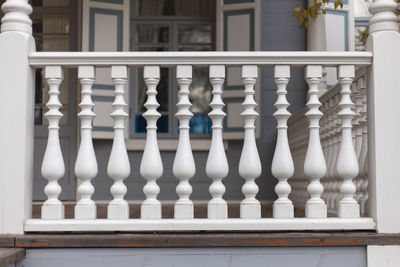 Close-up of chess pieces against railing