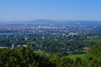 High angle view of trees and buildings against sky