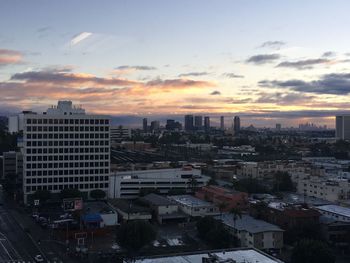 Cityscape against sky during sunset