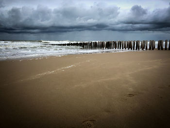 Scenic view of beach against sky
