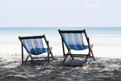 Lifeguard chair on beach against clear sky