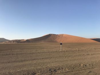 Scenic view of desert against clear sky