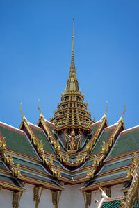 Low angle view of temple building against blue sky