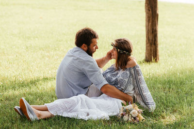 Couple sitting on grass