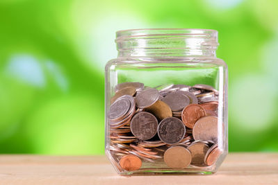 Close-up of coins in jar