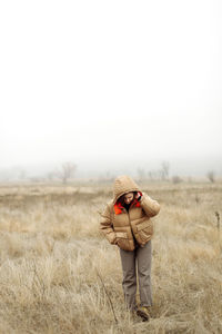 Portrait of young woman smiling outdoors